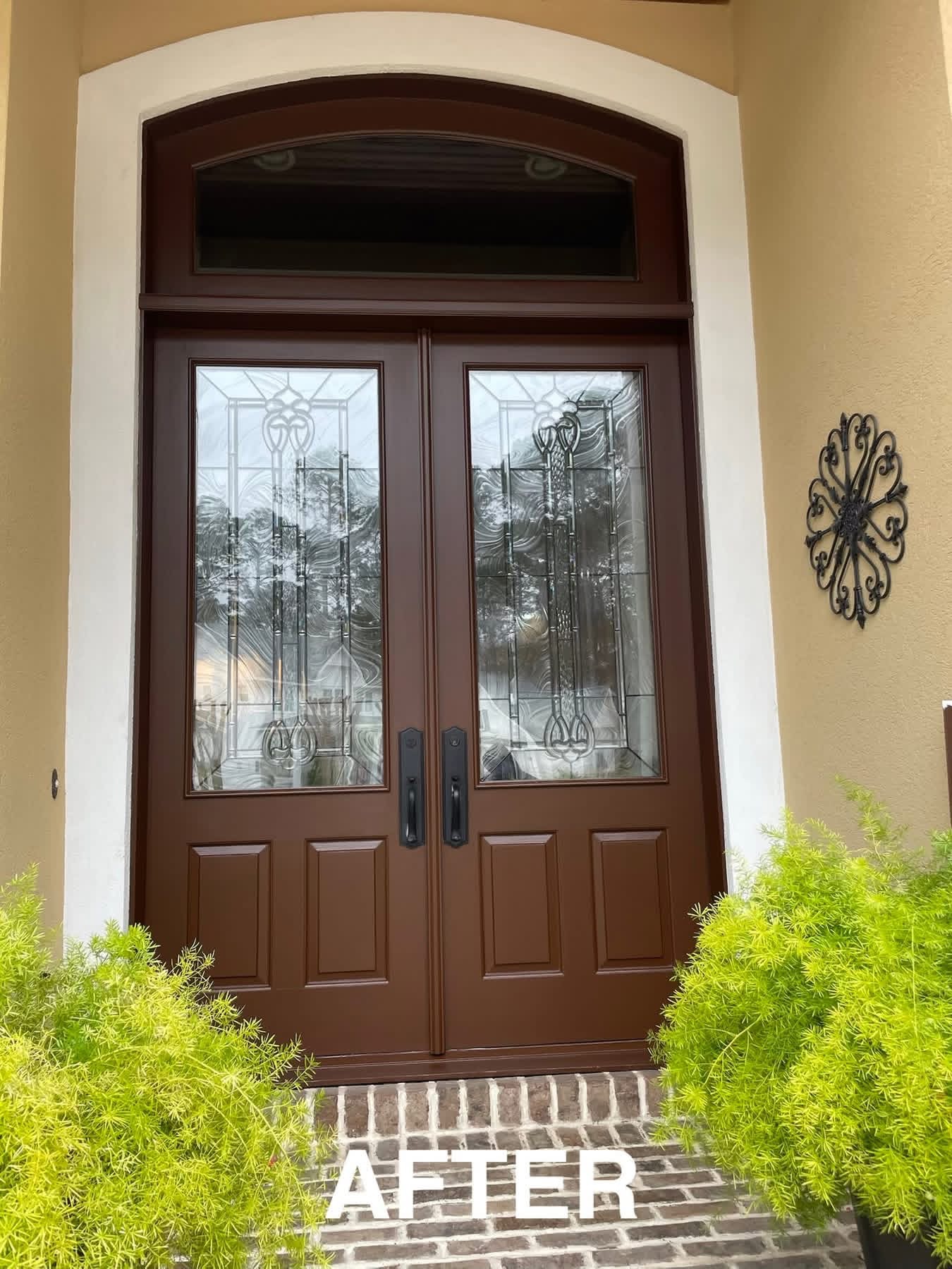 Rich dark brown refinished front door with decorative glass